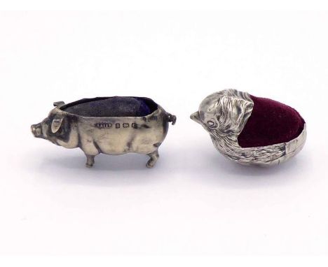 An Edwardian silver pig pin cushion by Adie & Lovekin Ltd., Birmingham, 1905, the purple velvet cushion heavily worn; and an 