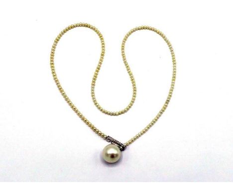 A cultured South Sea and seed pearl necklace, the necklace composed of uniform seed pearls, to a 13.9mm South Sea pearl drop,