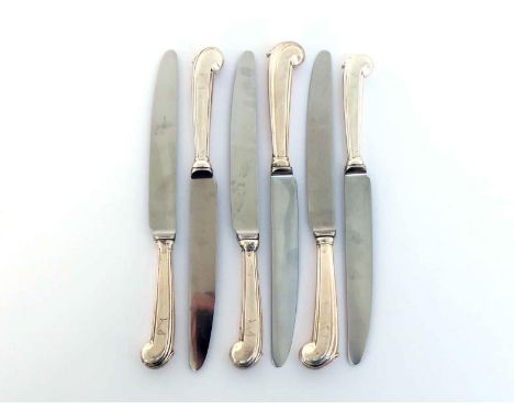 Four George II Irish silver pistol-handled knives and two more knives en suite with very slightly larger handles, Dublin, cir