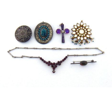 A group of vintage jewellery, including an Indian gilt metal, paste and seed pearl pendant; a garnet and white metal necklace