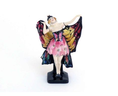 The very rare Doulton Butterfly ceramic model of a girl in butterfly costume. the underside with Royal Doulton green stamp an