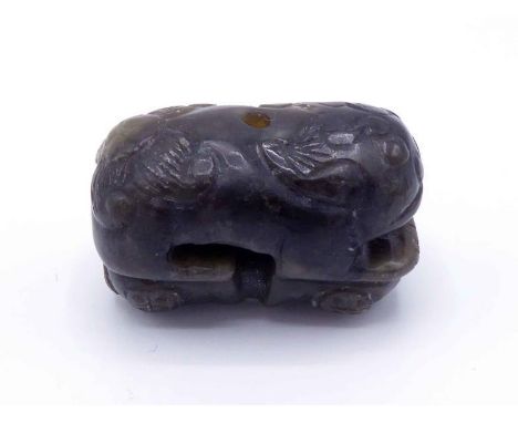 A Chinese carved grey jade attachment of a recumbent beast, Republic period or earlier, 19th/20th century, 3cm long, in good 