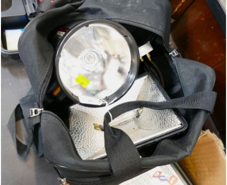 Bag of Omega Model CL500 half million candle power cordless spotlight and Thorn EMI Hayline 5 spotlight