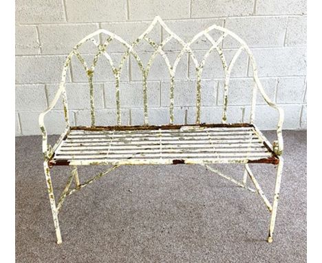 A vintage white painted garden bench; together with three composition stone garden ammonites and two bases (6)