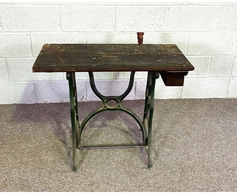 A vintage sewing machine table, converted as a small workbench; and a LLoyd Loom style linen basket and a typewriter (3)