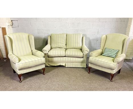 Two modern Wesley-Barrel upholstered armchairs; together with a similar small sofa, currently upholstered in light green stri