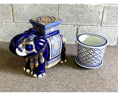 A modern Elephant garden seat, decorated with blue and yellow; together with a blue and white planter, with saucer (3)