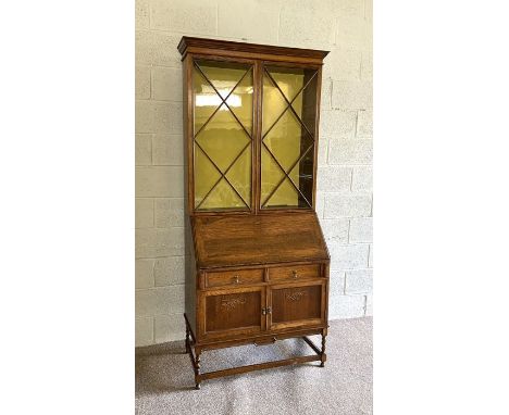 A vintage oak bureau bookcase, with glazed top and fall front