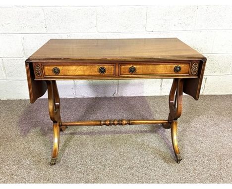 A reproduction Regency mahogany veneered sofa table, with drop leaf top and lyre supports, 73cm high, 92cm wide