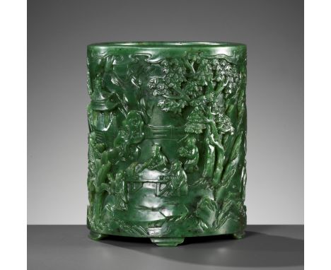 A SPINACH-GREEN JADE 'SCHOLARS' BRUSHPOT, BITONG, QIANLONG PERIODChina, 1736-1795. The massive and heavy vessel is of cylindr