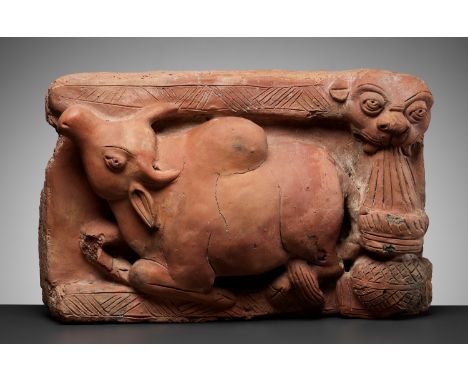 A TERRACOTTA RELIEF OF NANDI, GUPTA PERIODIndia, Uttar Pradesh, 6th century. Finely and heavily potted, the recumbent holy bu