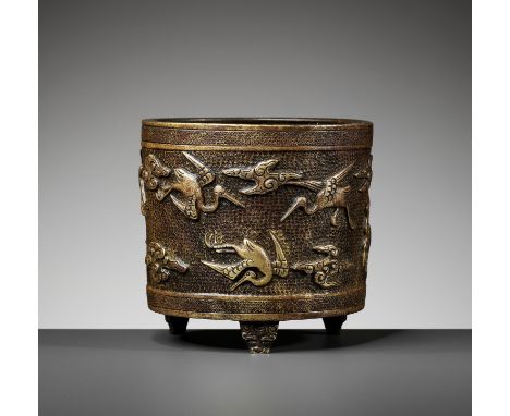 A HU WENMING PARCEL-GILT TRIPOD CENSER, MING DYNASTYChina, 17th century. The cast copper vessel is of cylindrical form, suppo