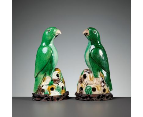 A PAIR OF SANCAI-GLAZED PARROTS, KANGXI PERIODChina, 1662-1722. Each finely modeled as a parrot perched on a pierced rockwork
