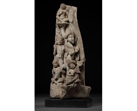 AN IMPORTANT 'MUSICIANS AND ATTENDANTS' SANDSTONE RELIEF FRAGMENT, 10TH CENTURYCentral India. The two standing attendants wea