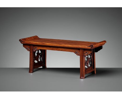 A HUANGHUALI TABLE-FORM STAND, LATE MING TO MID-QINGChina, 17th-18th century. Finely carved as a miniature recessed-leg table