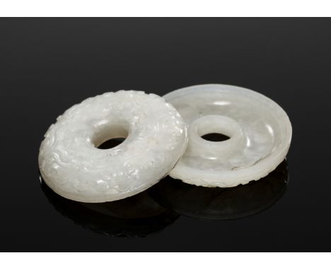 A WHITE JADE 'ARCHAISTIC' RING BOX AND COVER, 18TH CENTURYChina. Of convex ring shape and finely carved in relief with taotie