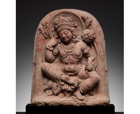 A TERRACOTTA RELIEF DEPICTING PADMAPANI, GUPTA PERIODNorth India, 4th-5th century. Seated atop a bed of lotus petals, holding