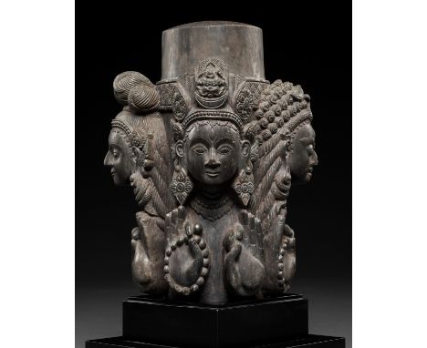 A CARVED STONE LINGA, NEPAL, 16TH-17TH CENTURYSuperbly carved with four faces each representing aspects of Shiva, all four ho