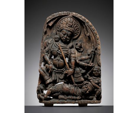 A CARVED WOOD STELE DEPICTING SHIVA SLAYING ANDHAKA, VIJAYANAGARA PERIODSouthern India, 16th-17th century. Boldly and deeply 