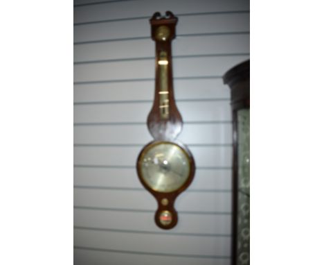 A 19th Century mahogany cased barometer having humidity and thermometer dials, silvered main dial and lower spirit level dial