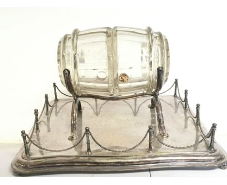 A silver plated tray fitted with a glass barrel decanter, no reserve. Dimensions 35x45x28cm approx.This item cannot be posted