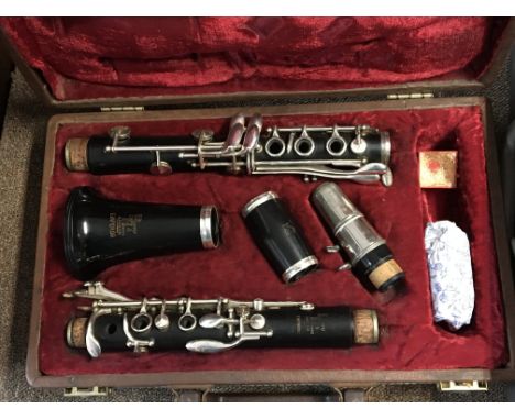 A Boosey and Hawkes Emperor clarinet in a fitted case and a brass trumpet (2)