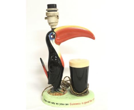 A Vintage Carlton Ware porcelain Guinness toucan lamp. Approximately 29cm tall. This item cannot be posted. No obvious damage