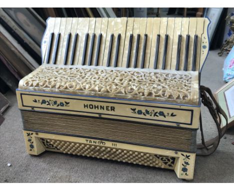 Two Hohner accordions including a Hohner Tango III and a cased Hohner. This lot cannot be posted