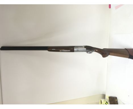 A Winchester 12 bore over under shotgun. Single trigger with ejector. Good condition. Serial number 12BMW01376 Please note th