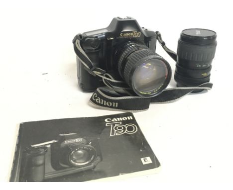 A Canon T90 Camera with a Bell & Howell 28-80mm lens and a Vivitar lens. Postage category C