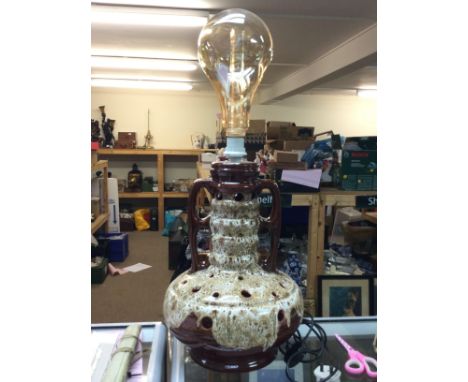 A West German pottery lamp, approximately 80cm tall. Postage category D. NO RESERVE