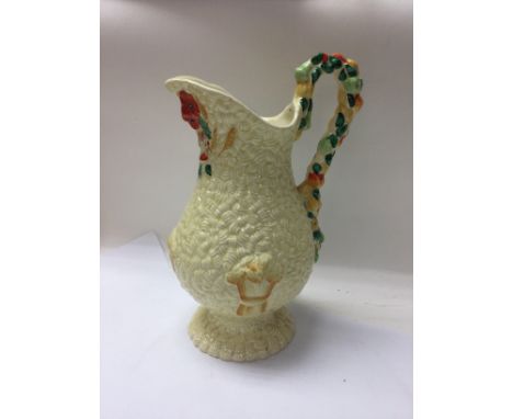 A Clarice cliff jug decorated with fruits. NO RESERVE