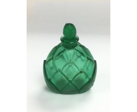 A Lalique green glass perfume bottle, signed R Lalique to base, approx height 8.5cm. Shipping category D.