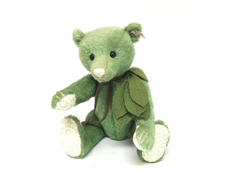 An unusual Green Steiff bear with crouched paws and a white nose possibly limited Edition.