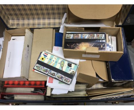A case containing a large collection of presentation packs first day covers and PHQ cards many still in envelopes (a lot)