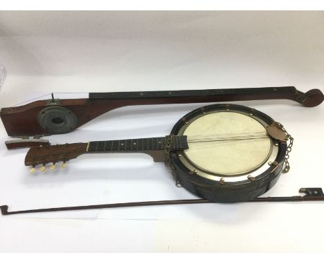 A banjolele and a monochord (2). Shipping category D.