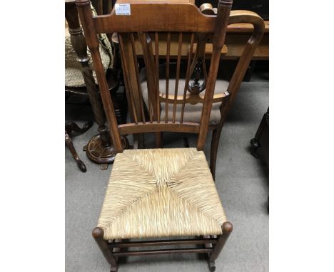 A elm stick back rocking chair with rush seat- NO RESERVE