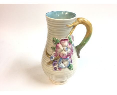 A Clarice Cliff my garden vase with decorative series of flowers. 21cm tall. No obvious damage observed. Postage D. NO RESERV
