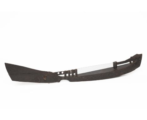 Sulawesi, Toraja, boat shaped two stringed instrument, late 19th - early 20th century, one one side decorated with geometric 