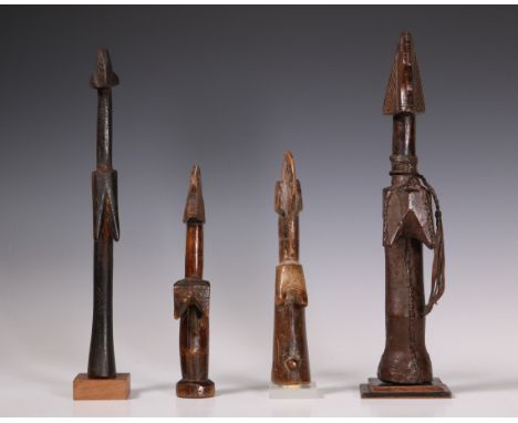 Burkina Faso, Mossi, a doll for three quater covered in leather. Herewith three other Mossi dolls. Provenance the collection 