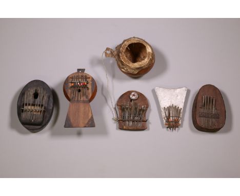 Central Africa, a collection of three metal sanza and two wooden sanza with gourd resonance box. Provenance the collection Mu