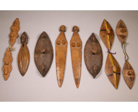 Mali, Bamana, a pair of wooden rythem instruments; Herewith four pair and one single clappers. Provenance: The private collec