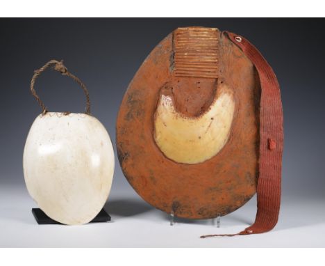 P.N. Guinea, Mount Hagen, breast ornament, Moka kina, pearl oyster shell, plant fibre on tree resin plate; herewith a Mendi C