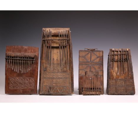 D.R. Congo/Tanzania, four sanza's. one with a carved airplane at the back and text. Provenance: The private collection of Mus