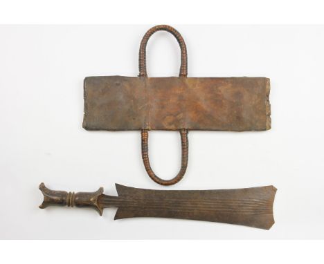 Three African weapons A Teke sword with leather sheet, a Songhe axe and a West African adze. [3] h. 53,5 cm. (Teke) 
