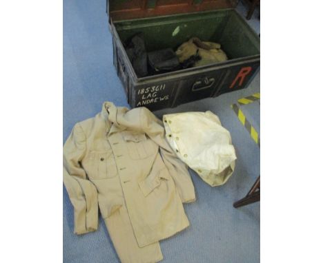 A WWII trunk containing clothing and gas masks 