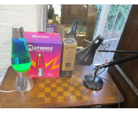 A Herbert Terry model 90 anglepoise lamp in black, along with a boxed Mathmos lava lampLocation: 