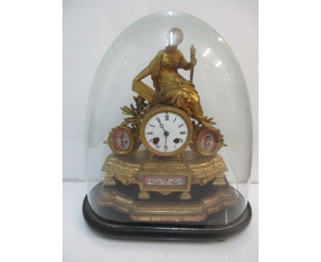 A late 19th century gilt spelter cased mantel clock with painted porcelain plaques under a glass dome A/F 