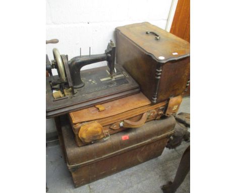 A vintage metal trunk, together with a leather case and a sewing machine 