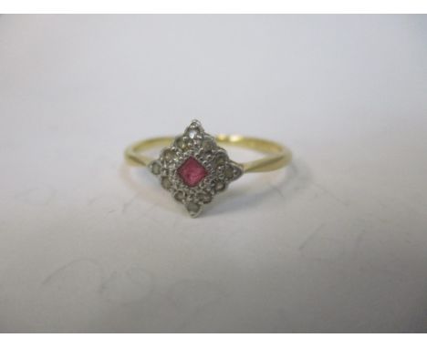 An 18ct gold ruby and diamond cluster ring 1.9g 